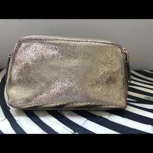 India Hicks gold cosmetic bag. Perfect condition.